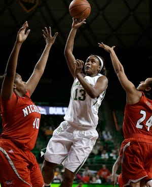 Baylor forward Nina Davis (13) goes up for a shot between Nicholls State's Marina Lilly (40) and Taylor Morrison (24) on Thursday in Waco. Davis had 28 points and 11 rebounds in her first career start as Baylor won 111-58.
