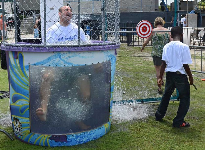 Vitti gets dunked in the "Shark Tank" at The Public Education Partners rally at Metropolitan Park in June.