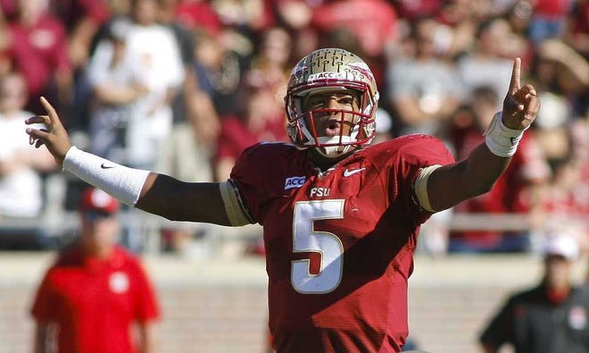 Florida State quarterback Jameis Winston (5) calls a signal in the first quarter of an NCAA college football game against North Carolina State on Saturday, Oct. 26, 2013, in Tallahassee, Fla. Florida State beat North Carolina State 49-17. (AP Photo/Phil Sears)