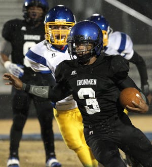 Cherryville's R.J. Abernathy, 3, breaks into the open on a touchdown run during Friday's first-round playoff game against Highland Tech at Rudisill Stadium.