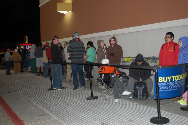 A crowd of more than 100 people wait in line to be among the first to buy the new PlayStation 4.