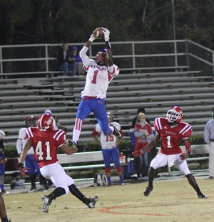 West Craven wide receiver Tyrone Brown (1) leaps to make a catch during the Eagles’ first round playoff game against Jacksonville. The Eagles lost 14-0.