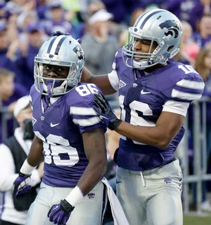 Kansas State wide receiver Tramaine Thompson (86) celebrates with wide receiver Tyler Lockett after Thompson scored a touchdown during the second half of an NCAA college football game against TCU, Saturday.