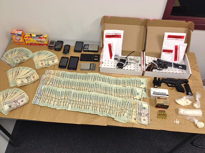 Evidence, including $7000 in cash and more than 107 grams of crack cocaine, seized during the execution of a search warrant at 103 Webster St., Apt. 2, Rockland, on Saturday night after the arrest of Kayla Jorge, 26, of 103 Webster St., Apt. 2, Rockland, and Jose L. Medina, 23, of 45 Holmes St., Brockton, who each face several gun and drug charges. (Photo courtesy Rockland Police Department)
**WITH STORY