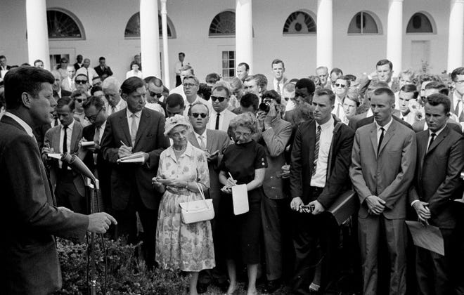 President Kennedy gives a personal farewell message to the first 80 Peace Corps volunteers in the White House Rose Garden on Aug. 28, 1961, before their departure the next day for assignments in Africa.