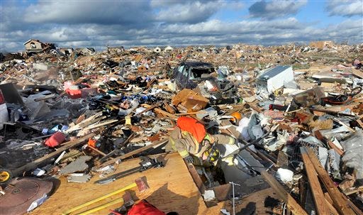 Fields of debris cover Washington after a tornado leveled areas of the town on Sunday.