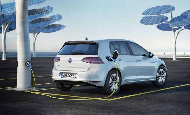 Provided by Volkswagen Charging the e-Golf's battery can be done with the available 220-volt wallbox for a garage or carport. Full charge takes less than four hours. The use of a 110/120-volt electrical socket will take around 20 hours to charge the battery.
