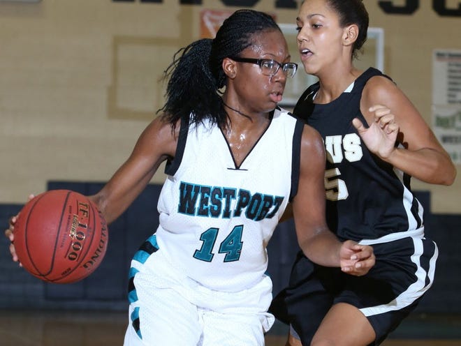 File - In this December 11, 2012 file photo, West Port's Navondra Dubois (14) drives to the basket around Citrus' Micah Jenkins (25) during a basketball game at West Port High School in Ocala, Fla. The Wolf Pack return Dubois, as well as the other four starters from a season ago.