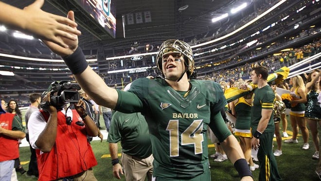 Quarterback Bryce Petty (14) of Baylor didn’t start the year on the Heisman radar, but he’s won over fans and experts alike. Like Winson, Petty has his team in the national title hunt with an unbeaten record. (Tom Fox/Dallas Morning News/MCT)