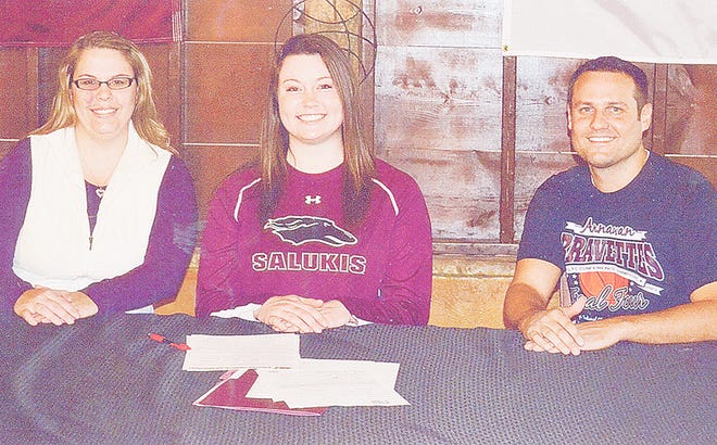Annawan all-stater Celina VanHyfte, center, signed a national letter of intent to play basketball at Southern Illinois University Saturday. VanHyfte is flanked by Bravettes assistant coach Caitlyn Corwin, left, and head coach Jason Burkiewicz, right.