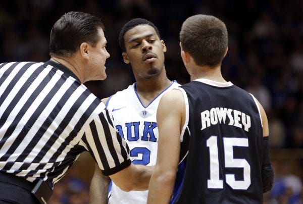 Duke's Quinn Cook stares down Andrew Rowsey during Monday's game. Cook held Rowsey, UNCA's leading scorer, to just two points.