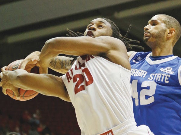 Alabama’s Levi Randolph is fouled by Georgia State’s Curtis Washington during Tuesday’s game. (Dave Martin | Associated Press)