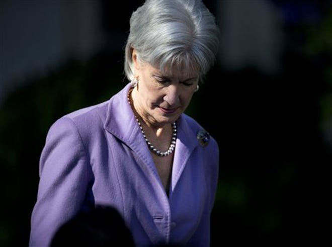 Health and Human Services Secretary Kathleen Sebelius arrives in the Rose Garden of the White House in Washington, Monday, Oct. 21, 2013, for and event with President Barack Obama on the initial rollout of the health care overhaul. Obama acknowledged that the widespread problems with his health care law's rollout are unacceptable, as the administration scrambles to fix the cascade of computer issues.