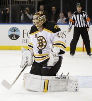 Boston Bruins goalie Tuukka Rask blocks a shot in the second period of their  game against the New York Rangers at Madison Square Garden in New York, Tuesday, Nov. 19, 2013.