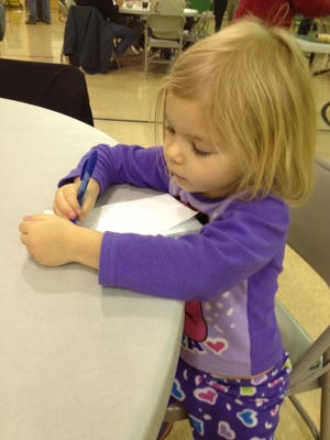 Ellie Wallheimer, 4, draws in a reporters notebook in November 2013.
