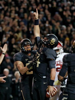 FILE - In this Nov. 7, 2013 file photo, Baylor 's Clay Fuller, left, celebrates with quarterback Bryce Petty, pointing to the sky after Petty kept the ball on a running play for a score against Oklahoma in the first half of an NCAA college football game, in Waco, Texas. Before you pencil in Alabama and Florida State, know that only six times since the BCS was implemented in 1998 have the top two teams in the BCS standings with three weeks to go in the regular season played in the championship game. So there's hope Ohio State and Baylor. And Auburn and Oregon and Missouri. (AP Photo/Tony Gutierrez, File)