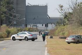 Savannah-Chatham Metro police on the scene at Hutchinson Island Road near the World Trade Center Savannah on Thursday morning after a body was recovered from the Savannah River-Janay Kingsberry/Savannah Morning News