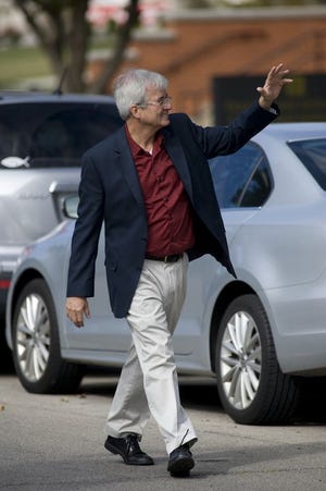 Monmouth College President Mauri Ditzler walks during this year's homecoming parade. Ditzler is leaving Monmouth at the end of the academic year after nine years. PHOTO COURTESY OF MONMOUTH COLLEGE
