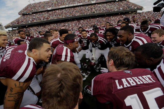 Texas A&M players gather before an NCAA college football game against Mississippi State Saturday, Nov. 9, 2013, in College Station, Texas. (AP Photo/David J. Phillip)