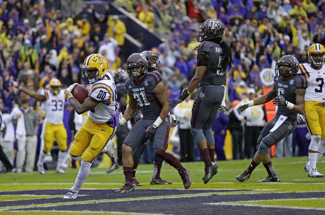 LSU wide receiver Jarvis Landry (80) scores a touchdown on a pass play in the first half against Texas A&M in their Southeastern Conference football game Saturday in Baton Rouge, La. Landry caught four passes for 87 yards and two touchdowns, and No. 18 LSU beat No. 9 Texas A&M, 34-10.