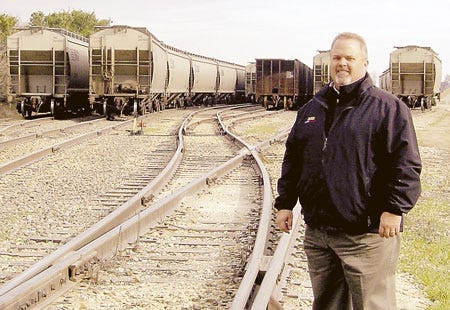 Michelle Patrick/Journal
Richard Hollister stands with 100 railroad cars of soybeans Nov. 15 at The Anderson’s in White Pigeon. The trains were heading to New Orleans, where they would be loaded onto export boats destined for the Pacific Rim.
