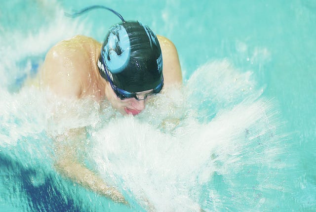 Bartlesville High School Bruin swimmer Alex Ward slices through the water during the Phillips 66 Bruin Invitational competition Saturday. Bartlesville finished second in the boys team standings. Mike Tupa/Examiner-Enterprise