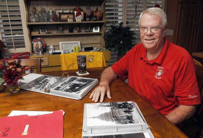 Terry.Dickson@jacksonville.com Harry Moffett sits with scrapbooks packed with photos and other memorabilia from his marching as a Marine lance corporal in the color guard in John F. Kennedy's funeral procession.