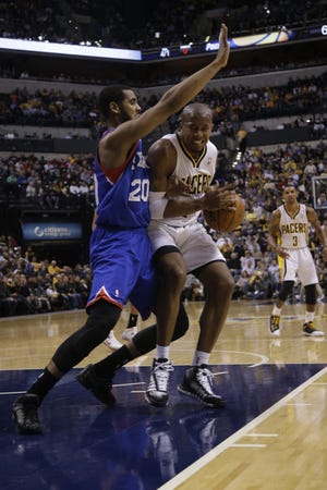 Pacers forward David West (21) prepares to go up for a shot on the Sixers' Brandon Davies during Saturday night's game in Indianapolis.
