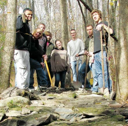 Submitted photo - Students fill a rock crib frame with dirt and rock. From left are Michael Tyler, Ryan May, Joe Thompson, Brendon McKenna, Angela Lanham, Joe Ferraro, Rick Linenby and Seth Simko. Not pictured are Paul Frangipane and Dan Hromnak.