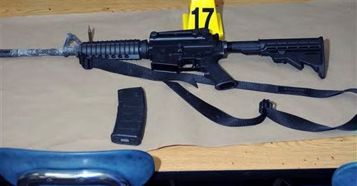 This image contained in the "Appendix to Report on the Shootings at Sandy Hook Elementary School and 36 Yogananda St., Newtown, Connecticut On December 14, 2012" and released Monday, Nov. 25, 2013, by the Danbury, Conn., State's Attorney shows a weapon found at Sandy Hook Elementary School in Newtown, Conn. Adam Lanza opened fire inside the school killing 20 first-graders and six educators before killing himself as police arrived. (AP Photo/Office of the Connecticut State's Attorney Judicial District of Danbury)