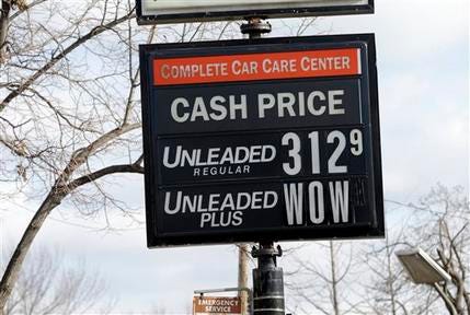 The cash price for unleaded fuel along with an editorial comment on unleaded-plus fuel was posted on a sign at a Minneapolis care care center Tuesday, Nov. 26, 2013, in Minneapolis, as gas prices continue to fall just in time for Thanksgiving and holiday spending.