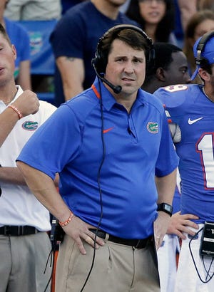 Florida head coach Will Muschamp watches the final minutes of an NCAA college football game against Georgia Southern in Gainesville, Fla., Saturday, Nov. 23, 2013. Georgia Southern won the game 26-20.(AP Photo/John Raoux)