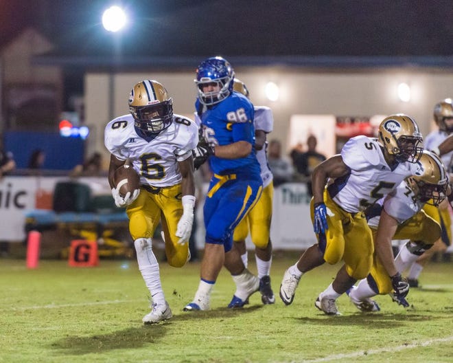 Covington's C.J. Sims ran for 241 yards and three scores against the Spartans. Photo by Dewey Keller.