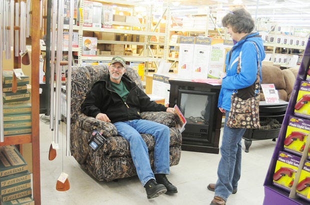 At the Busy Beaver in the Franklin Plaza Friday Terry and Wendy Grimes of Shenango Township check out the camouflage recliner while .
