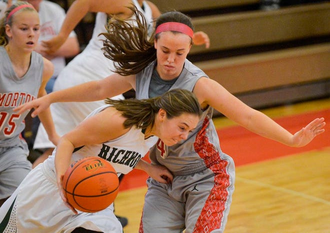 Chandler Ryan of Morton pressures Olivia Elger of Richwoods with the ball during Saturday's game.