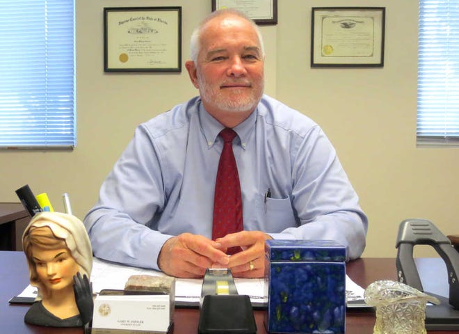 SHELDON.GARDNER@STAUGUSTINE.COM Gary Smolek, an attorney for the Public Defender, sits in his office at the St. Johns County courthouse complex. Smolek has handled thousands of cases in his career. He plans to retire in 2015.