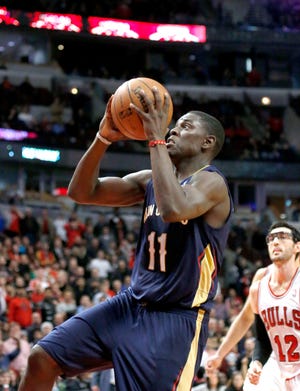 New Orleans Pelicans point guard Jrue Holiday (11) drives and scores the winning basket during the third overtime period against the Chicago Bulls on Monday. The Pelicans won 131-128 in triple overtime.
