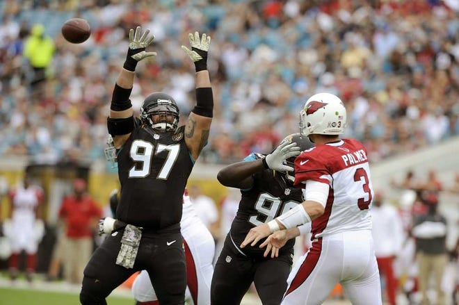 Associated Press Jacksonville defensive tackle Roy Miller (97) jumps to block a pass from Arizona quarterback Carson Palmer (3) during the first half at EverBank Field on Nov. 17