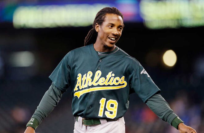 FILE - In this Sept. 29, 2013, file photo, Oakland Athletics' Jemile Weeks heads onto the field against the Seattle Mariners in a baseball game in Seattle. The Oakland Athletics have acquired AL saves leader Jim Johnson from the Baltimore Orioles for Weeks and a player to be named. The teams announced the trade Monday, Dec. 2. (AP Photo/Elaine Thompson, File)
