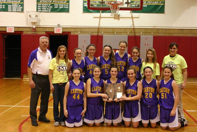 The Canton Lady Giants proudly hold the sectional championship plaque they won by defeating Normal Parkside 27-14 in the Morton 7-4A title game Wednesday night. Now 23-0, coach Mike Martin’s team plays Minooka (21-1) on Saturday at 11:30 a.m. in the IESA State Tournament which is being played at Normal Parkside.