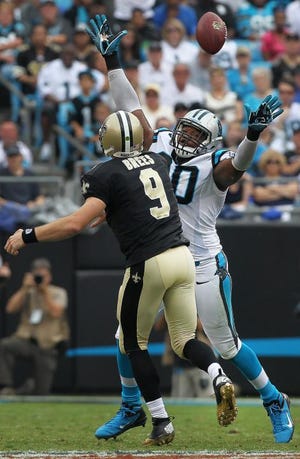 Panthers defensive end Frank Alexander deflects a Drew Brees pass during last season's Panthers’ 35-27 win over the Saints Sunday at Bank of America Stadium on Sept. 16 .