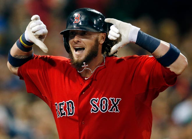 Jarrod Saltalamacchia gestures as he runs toward the dugout after his grand slam in the seventh inning helped clinch Friday's win over the Yankees.