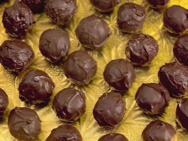 Homemade chocolate truffles are made from a simple mix of bittersweet chocolate, heavy cream, salt and cocoa powder.