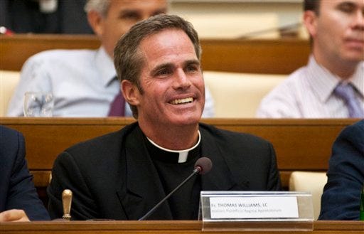 In this 2011 file picture, Father Thomas Williams gestures during a meeting in Rome. Thomas Williams, the onetime public face of the disgraced Legion of Christ religious order who left the priesthood after admitting he fathered a child, is getting married this weekend to the child's mother, The Associated Press has learned.