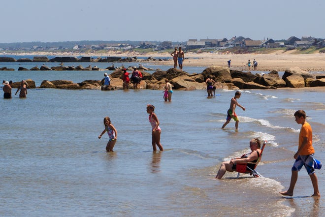 People enjoy Town Neck Beach in Sandwich on a warm Friday afternoon in July.