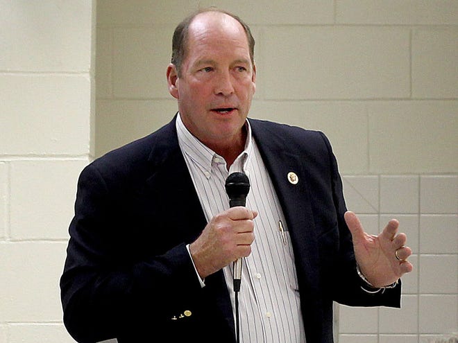 In this Nov. 5, 2013 file photo, U.S. Rep. Ted Yoho speaks to the audience during a town hall meeting at Chiefland Middle School in Chiefland.