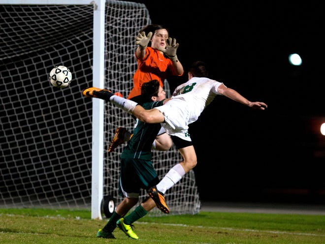 Forest's Tyler Sanville gets the ball past Lecanto goalie Ryan Stevens for the game's only goal in the Wildcats' 1-0 win on Friday night.