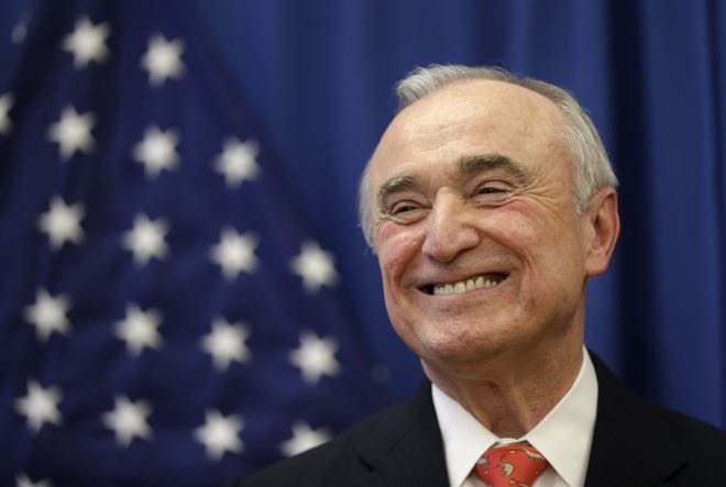 William Bratton smiles during a news conference in New York on Thursday, Dec. 5, 2013. Bratton has been chosen to lead the New York Police Department again.