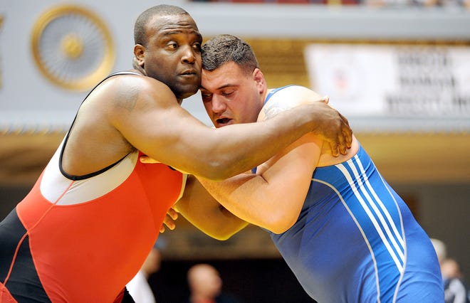 Kings Mountain native Dremiel Byers, left, goes head to head with U.S. Army World Class Athlete Program teammate Spc. Timothy Taylor for the 120-kilogram/264.5-pound Greco-Roman title at the 2011 U.S. Open Wrestling Championships. With the victory, Byers won his ninth national championship.