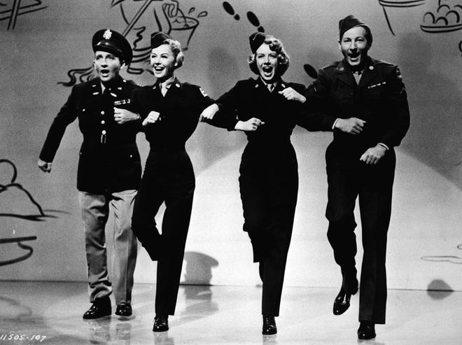 Singer Rosemary Clooney, second from right, dances with, from left to right, Bing Crosby, Vera-Ellen, and Danny Kaye in this 1954 photo from the film "White Christmas." (AP Photo)